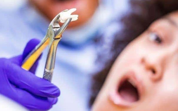 nằm mơ thấy nhổ răng